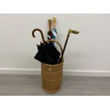 WICKER STICK AND UMBRELLA STAND CONTAINING 3 UMBRELLAS AND ONE WALKING STICK