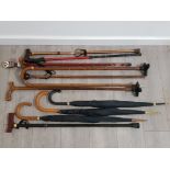COLLECTION OF VINTAGE WALKING STICKS AND UMBRELLAS