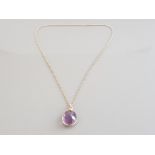 14CT YELLOW GOLD AMETHYST PENDANT SET WITH A SINGLE AMETHYST PENDANT COMPLETE WITH BELCHER CHAIN 7.