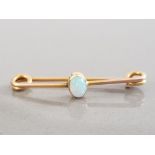 LADIES 9CT YELLOW GOLD OPAL BROOCH FEATURING AN OVAL SHAPED OPAL SET IN THE CENTRE 1.2G GROSS