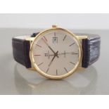 GENTS 9CT YELLOW GOLD ZENITH WATCH EITH CHAMPAGNE DIAL AND GOLD BATON HOUR MARKERS WITHBK BROWN