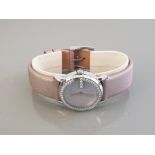 LADIES STAINLESS STEEL GUCCI WATCH FEATURING MOTHER OF PEARL DIAL WITH DIAMOND BEZEL AND PINK