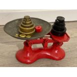 vintage balance scales in red with loose weights