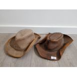 2 cowboy hats made from suede and leather