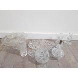 Collection of crystal cut glass items includes cake stand, vase, candlesticks and perfume bottle