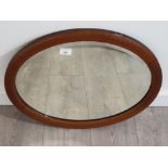 Inlaid mahogany oval shaped bevelled edge mirror 56 x 47 cm