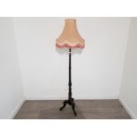 Mahogany pedestal standard lamp with fringed shade