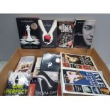 A box of miscellaneous books Including hunger games twilight etc
