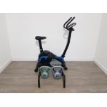 Roger black exercise bike and trainer and 10kg and 12kg kettle bells