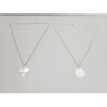 2 hallmarked silver talisman pendants on 19 inch fine silver Belcher chains issued and made by the