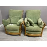 Pair of ERCOL model 1067 armchairs, blonde frames with green fabric cushions, H95cm x W88CM x D65cm