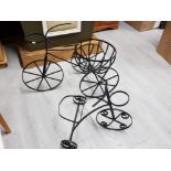 2 metal garden planters in the shape of three wheel bikes