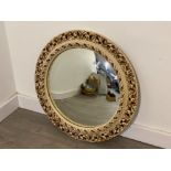 Large circular decorative wall mirror, with a carved cream frame