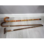 Ethnic style walking stick and 2 others with neck collars of white plus yellow metal unmarked