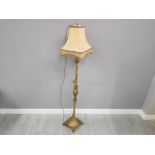 Ornate brass standard lamp and shade