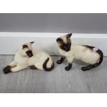 Beswick standing siamese cat together with a lying royal doulton siamese cat in great condition