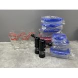 5 Coca Cola glasses sealed tubs and 2 salt and pepper grinders
