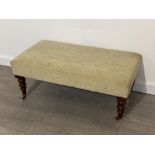 Large rectangular shaped Upholstered footstool with mahogany and brass castor foot supports 93x48cm