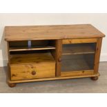 Pine entertainment unit with glazed door, 102x44cm