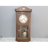 Arts and Crafts oak wallclock with pendulum and key, 78x 34cm