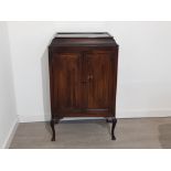 Mahogany piano scroll and sheet music twin door cabinet, 112x69x43