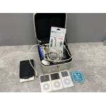 3 iPods and case containing accessories