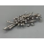 18ct white gold ornate diamond flower cluster brooch. Comprising of round brilliant cut diamonds and