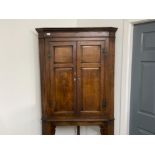 George III corner cabinet with ivory eschuctchions mounted on later stand. A magnificent piece