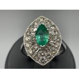 18ct white gold Emerald and diamond marquise shape cluster ring. Comprising of a single marquise
