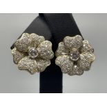 Stunning 14ct gold diamond flower cluster stud earrings. Comprising of single round cut brilliant