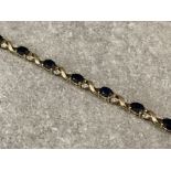 9ct gold 13 sapphire and 26 diamond crossover link bracelet 17cms 6.98g