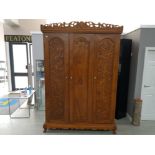 Malaysian wood heavily carved triple door wardrobe with three keys, 246x162x62cm