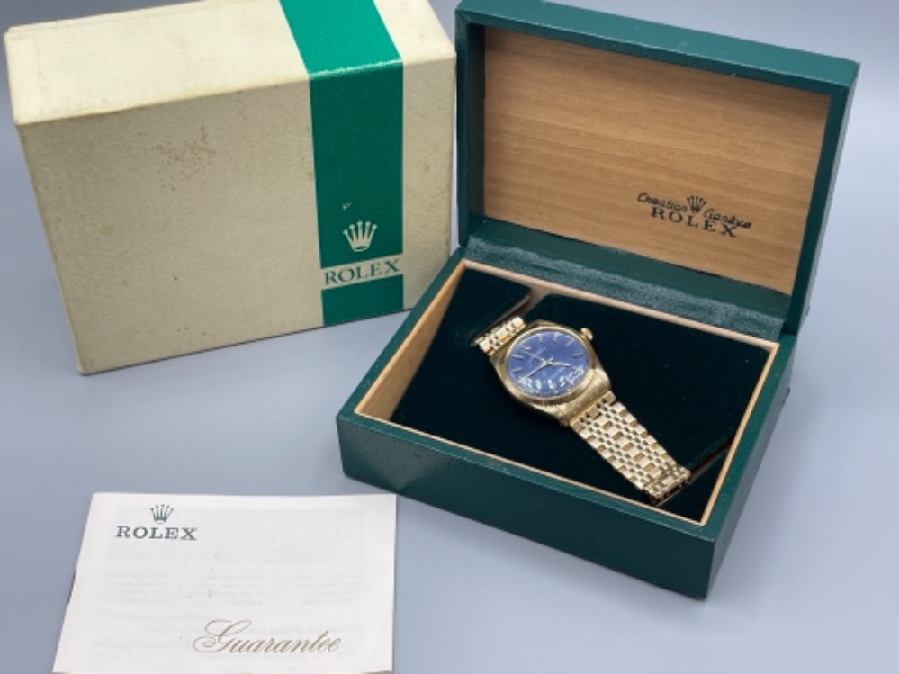 Rolex gents 14ct gold oyster perpetual watch with blue dial set with baton hour markers. Self wind