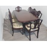 Large extending mahogany dining table and 8 shield back chairs, 2 carvers 6 singles with extra