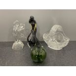 4 items including figures and glass