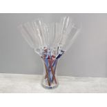 9 champagne flutes, glasses with mixed coloured stems and flute holder vase