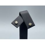 Pair of 14ct white gold diamond stud earrings .50ct