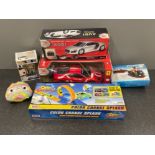 Box and toys including Ferrari remote control car and others