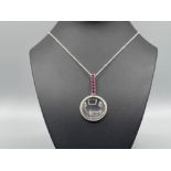 Silver and ruby magnifying glass pendant and chain