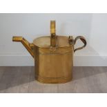 Large antique brass watering can, stamped 10 to the base . Height 40 cms