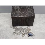 Carved wooden musical trinket box and contents