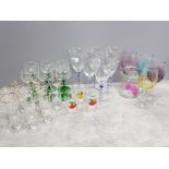 Selection of mixed drinking glasses some with coloured stems