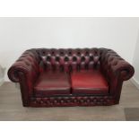 Thomas lloyd two seater Chesterfield sofa in the classic ox-blood red