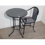 Metal bistro table and matching armchair