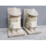 Pair of heavy stoneware bookends in the shape of sleeping oriental figures