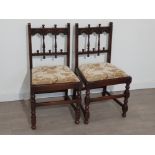 Pair of nicely carved dark Ercol framed chairs