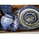 Box containing blue and white bowls and plates, different makers include Doulton, Spode etc
