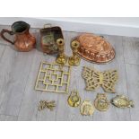 Selection of brass and copper ware includes brass push candlesticks, Victorian copper jelly mould,