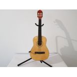 Acoustic guitar on stand