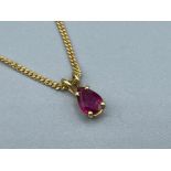 Ladies 18ct gold ruby pendant and chain approx .84ct